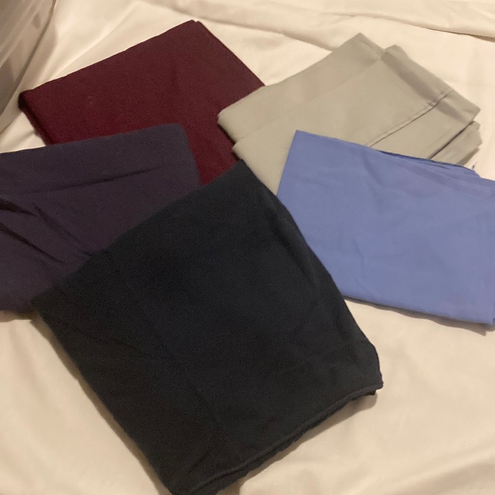 Dark red, light green, baby blue, and 2 dark blue pillow cases